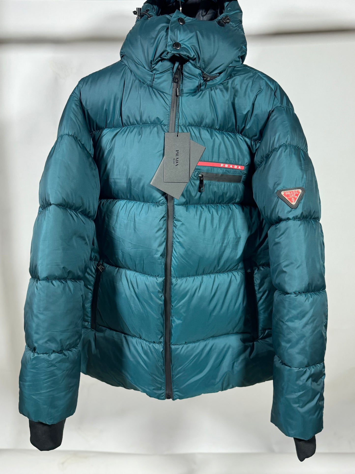 PRADA Men’s Premium Petrol Blue Puffer Jacket with Leather Patches and Detachable Hood